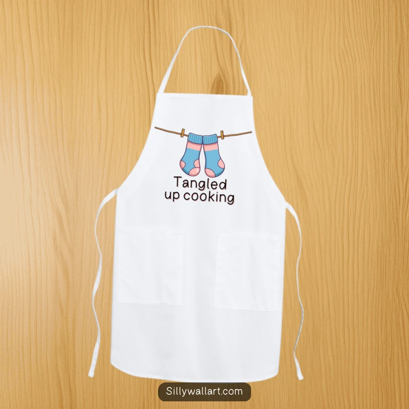 Funny apron, socks comically tangled on a clothesline like kites, bringing laundry humor to the kitchen.