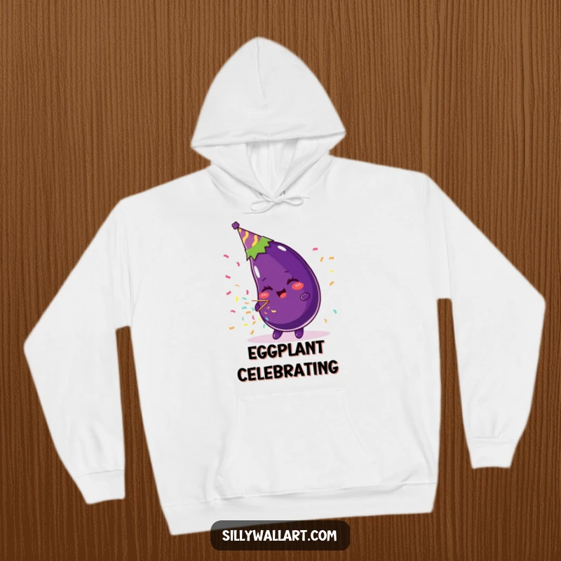 Funny hoodie featuring a beaming eggplant wearing a festive party hat and happily blowing a confetti popper, ready for celebration.
