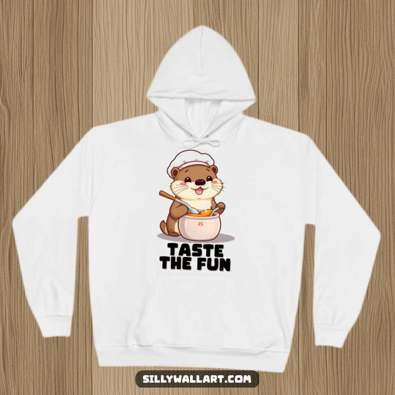 Funny hoodie showcasing a happy kawaii otter chef enthusiastically tasting from a pot, a symbol of warmth and culinary joy.