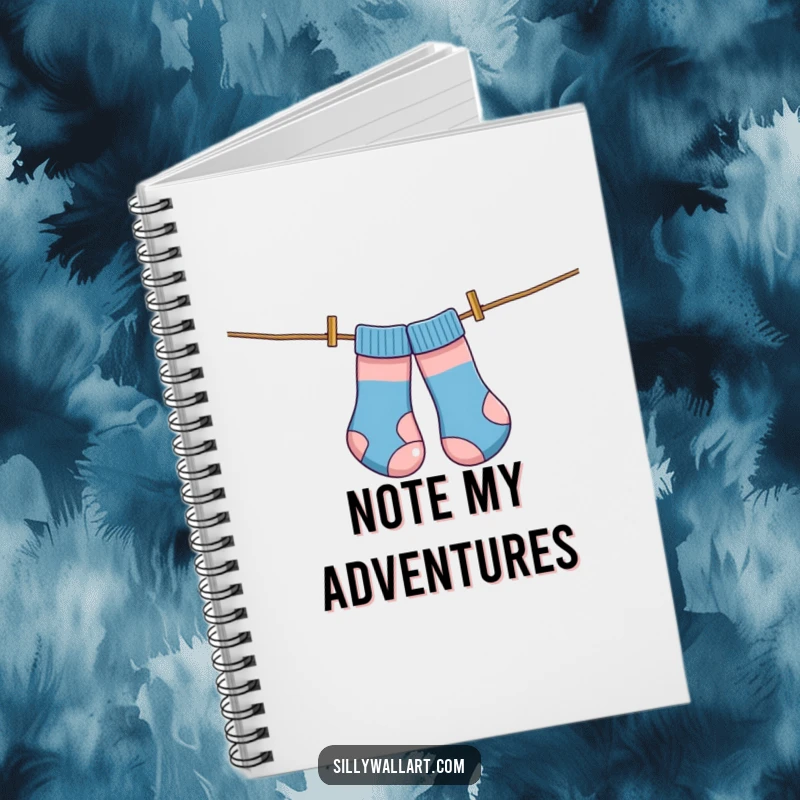 Funny notebook, socks comically tangled on a clothesline like kites, perfect for jotting down humorous thoughts.
