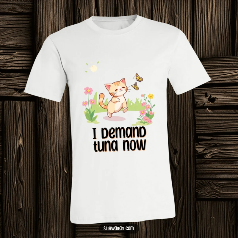 Funny t-shirt featuring a determined cat mid-chase after a delicate butterfly amidst a bright, sunlit garden.