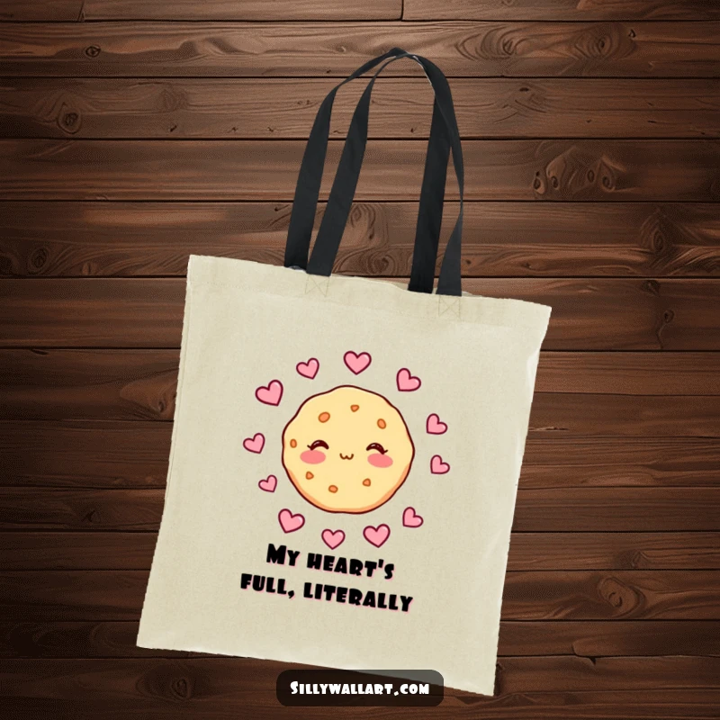 Funny tote bag featuring a blushing cookie surrounded by hearts, ideal for carrying daily items with a sweet and humorous romantic flair.